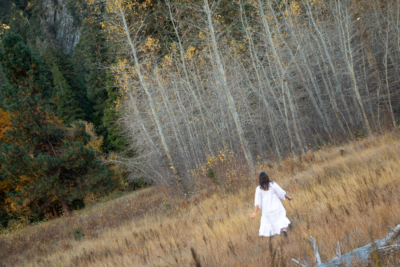 A figure runs through a field.